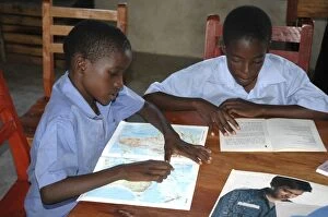 Book Gallery: Schoolchildren reading books, Uganda, Africa