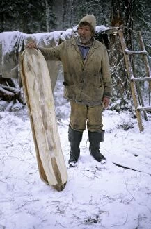 Selkup Man (North Siberia minority) shows his wooden