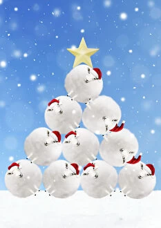 Sheep snowballs wearing Christmas hats stacked