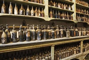 Showroom with old dust covered sherry bottles at the B
