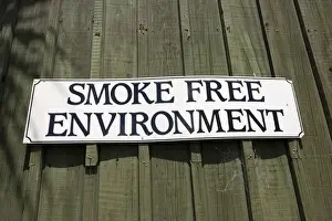 Smoke Prints: Sign - smoke free environment notice on cafe Rotorua, North Island, New Zealand