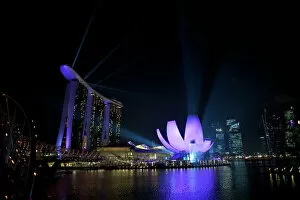 Singapore - Marine Bay sands and art science museum (right) night laser show
