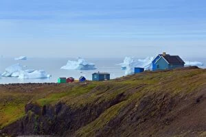 Sisimiut colourful houses with icebergs