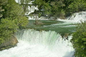 Skradinski Buk - upper area of Skradinski Buk waterfall cascading down limestone cliffs Skradinski Buk - upper area of Skradinski Buk waterfall cascading down limestone cliffs