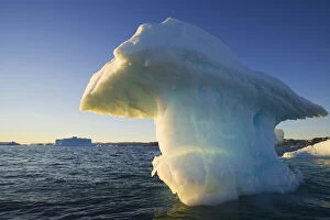 Iceberg Gallery: Small iceberg drifting in Disko Bay, midnight
