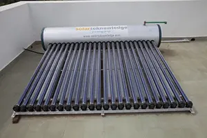 Alternative Energy Prints: Solar thermal water heating system with tank and evacuated tubes on roof of house - Mombasa - Kenya