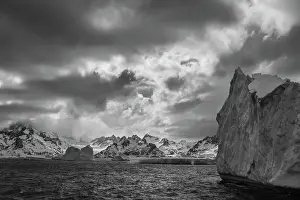 Atlantic Prints: South Georgia Island. Black and white Landscape of iceberg floating in the Atlantic and mountain scenery