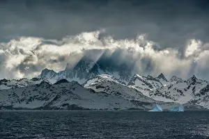 Opening Prints: South Georgia Island. Opening in clouds and Virga reveal the mountainous and glaciated landscape