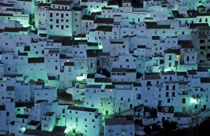 Spain - The brilliant White Town of Casares, spectacularly clinging to a steep hillside; at dawn. Province of Malaga, Andalucia, Spain