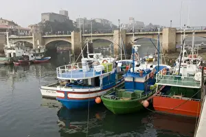 Moored Prints: Spanish trawlers moored on quayside near bridge San Vicente de la Barquera Spain