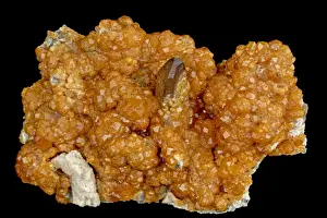 Spessartine Garnet (Mn3Al2Si3O12) with Smoky Quartz (SiO2) (single crystal) and Feldspar (pink) - Fugian Province China - Manganese aluminum silicate - Garnet is one of the most common of all minerals - Spessartine garnet is used primarily as a