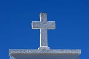 Stone Cross - white stone cross against a blue sky