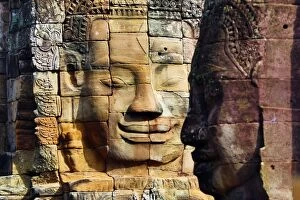 Angkor Gallery: Stone face in the ruins of the Bayon Khmer Temple, Angko