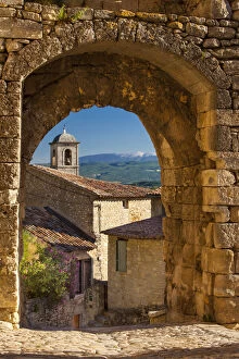 Stone gate in Lacoste with Mount Ventoux