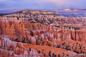 Storm over Bryce Canyon - view from Sunset Point over the amphitheatre of hoodoos and eroding fins of Bryce Canyon. A storm is brewing over the canyon chasing low clouds into the amphitheatre