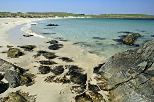 Images Dated 1st June 2007: Summer beach - approaching wave, blue sea, rocks and white sand at beach of Scousburgh Sands