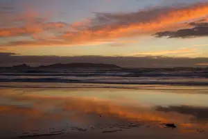 Seascapes Prints: Sunrise spectacular sunrise over the ocean with clouds blazing in all hues of yellow and red