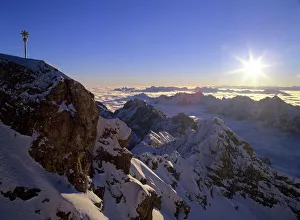 Alpine Collection: Sunrise on Zugspitze view from highest mountain of Germany with summit cross at sunrise Bavaria