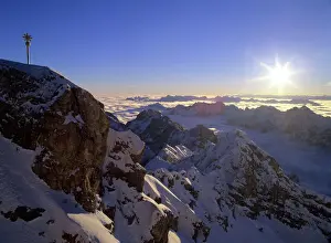 Scenery Prints: Sunrise on Zugspitze view from highest mountain of Germany with summit cross at sunrise Bavaria