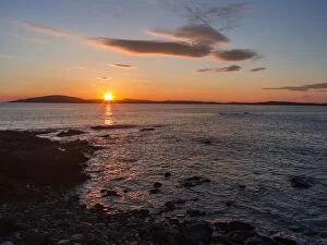 Sunset over the island of Papa Stour. Shetland