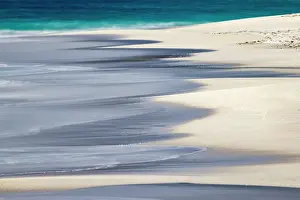 Surf Prints: Surf pattern washing up on white sandy beach
