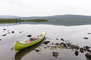 Sweden, Norrbotten, Torne River. Canoe in