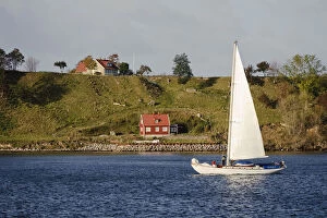 Sweden, Skane, Isle of Ven. Sailboat passing