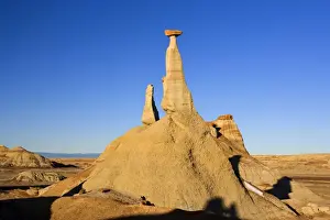 Clay Prints: Tall Hoodoo - eroded clay sculptures with rocks balanced on their tops located amidst badlands - Bisti Badlands