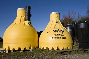 Images Dated 12th November 2008: Tanks - Large yellow plastic Wisy rainwater storage tank. Green Shop Bisley UK