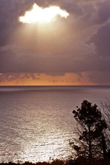 Seascape Collection: Thunderstorm parting clouds leaving room for a sunbeam breaking through Adriatic coast, Montenegro