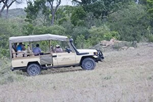 Tourists game viewing from vehicles
