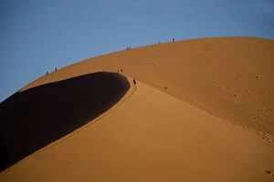 Tourists walking along Dunes