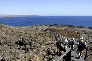 Images Dated 12th April 2005: Tourists walking along path on Bartolome Island