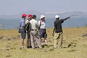 Tourists walking with wildlife ranger