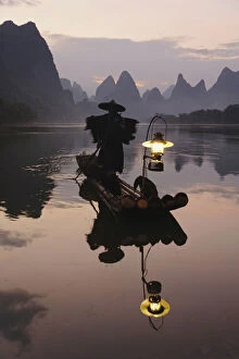 Traditional Chinese fisherman with cormorants