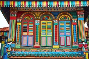 Traditional rainbow coloured house with colourful window