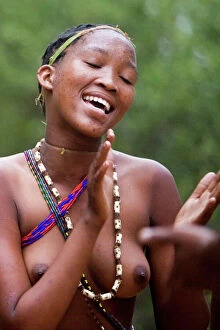 Afric Gallery: Tribal Dancer - Bushmen Girl dancing in Manghetti dunes