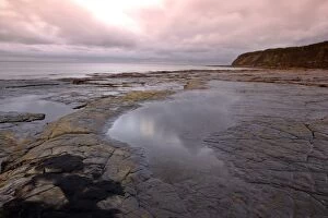 Images Dated 23rd October 2006: UK - Kimmeridge Bay striated rock ledges at low tide during a storm
