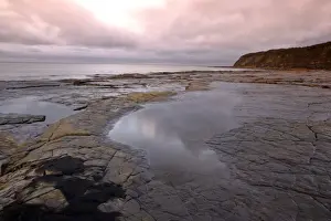 Ledge Prints: UK - Kimmeridge Bay striated rock ledges at low tide during a storm