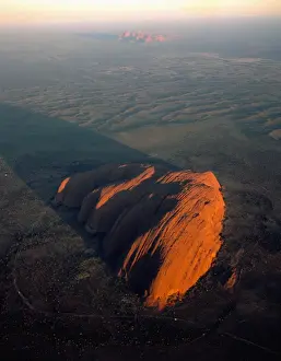 Uluru (Ayers Rock) at sunrise, aerial, Uluru-Kata Tjuta National Park (World Heritage Area), Northern Territory, Australia JPF44471