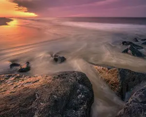 USA, New Jersey, Cape May National Seashore. Sunset reflections on beach. Date: 15-03-2021