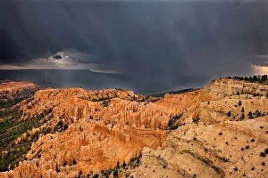 Images Dated 18th May 2021: USA, Utah, Bryce Canyon National Park. Sunrise on storm clouds and sandstone hoodoo formations
