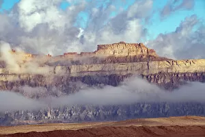 Images Dated 22nd April 2022: USA, Utah. Green River, Cloud and Mist Shrouded Little Elliot Mesa