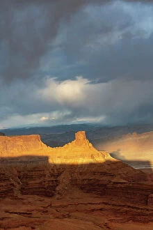 Storm Gallery: USA, Utah. Sunset light breaking through desert