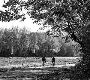 Recreation Collection: USA, Washington State, Fall City black and white two bike riders along Neal Rd. S.E
