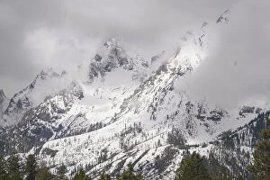 Images Dated 22nd June 2021: USA, Wyoming, Grand Teton National Park. Clouds over mountains during spring snowstorm