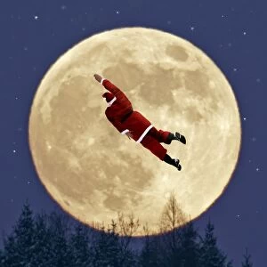 USH-3924-M-C Father Christmas - flying on his bicycle past a full moon - above forest in winter