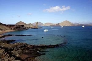 Images Dated 12th April 2005: View of coastline and incoming boats from Bartolome Island, Galapagos Islands