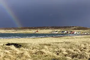 Storms Prints: Village d'Ekkoroy by Varanger fjord with storm clouds and rainbow - Norway