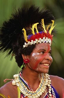 Villager portrait of tribeswoman wearing headdress